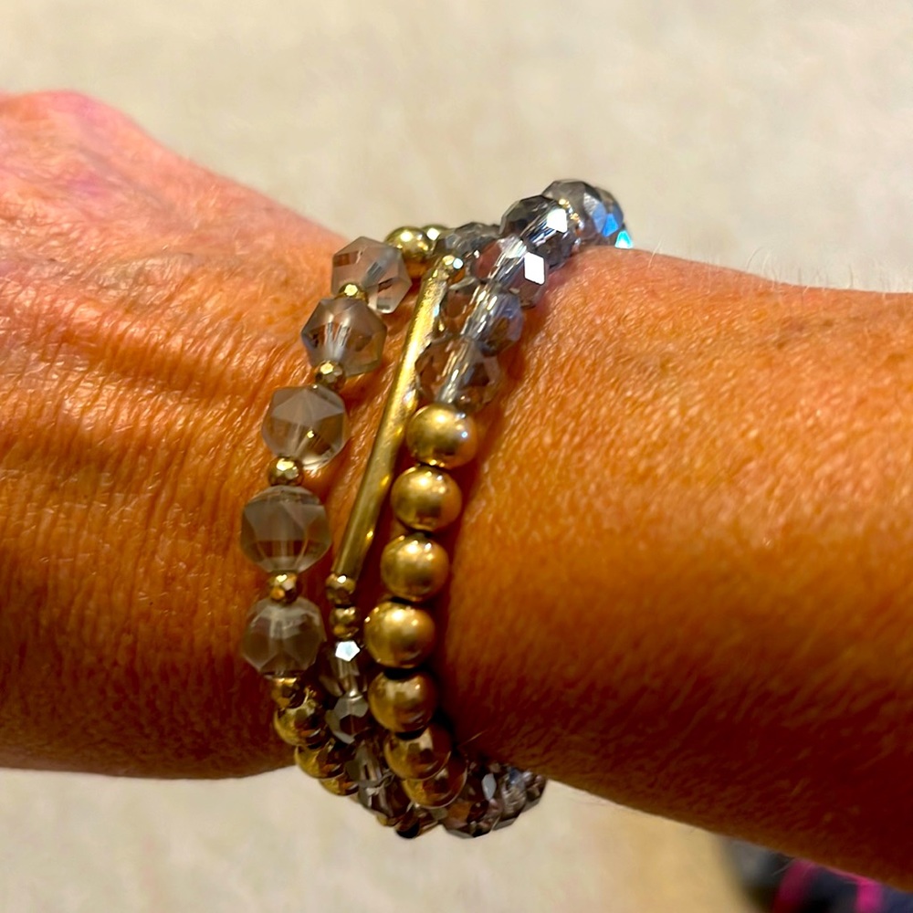 3 shimmery gold and grey toned stacking bracelets